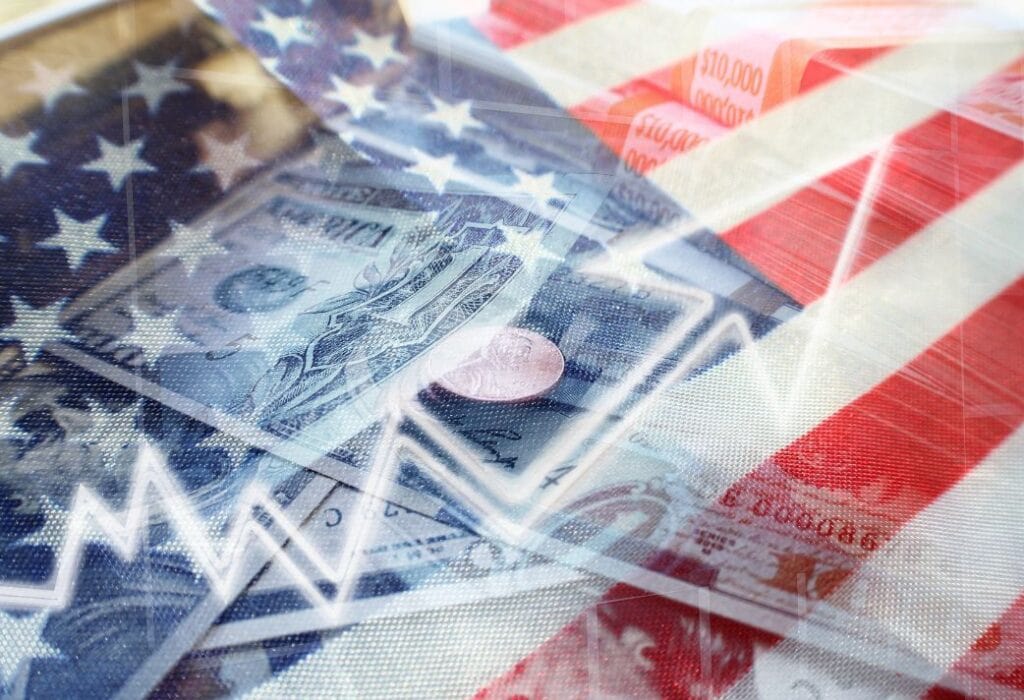 Image of U.S. currency overlaid on an American flag with a financial graph, symbolizing the intersection of economy and patriotism.